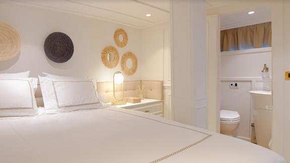 The master cabin on Liberte 11 offers comfort with stylish decor and a spacious bathroom.